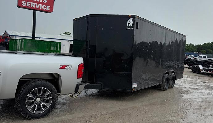 A 102 inch 20ft enclosed trailler hauled by pickup