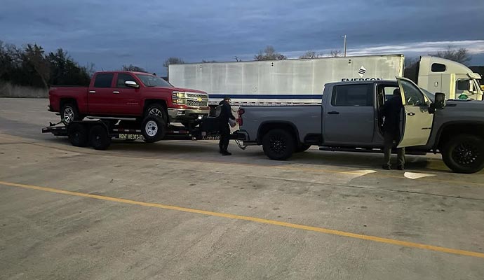 Project vehicle being towed on a trailer for transport